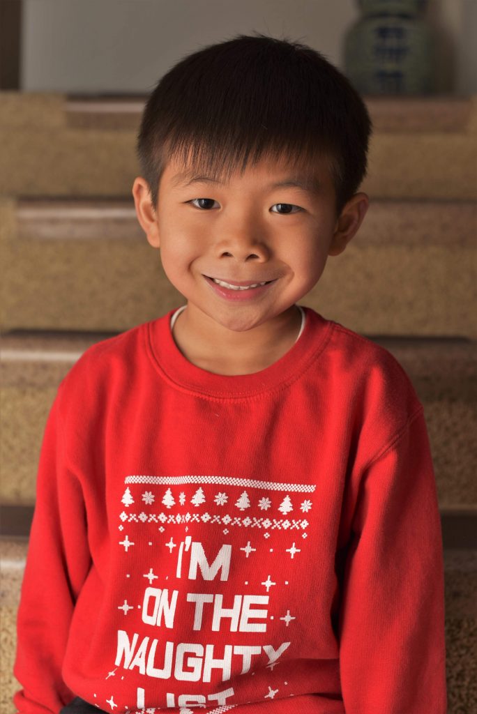 My cousin Jalen stopped while sliding down the stairs for a photo.