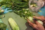 grandma cutting vegetables for different lao dishes