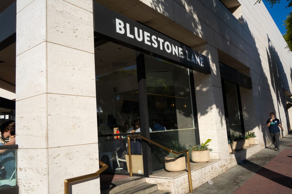 The Bluestone Lane sign hangs outside of the Westwood location. The Westwood Bluestone Lane is located on Westwood Boulevard, near Target. Photo by Xiang Li/BruinLife