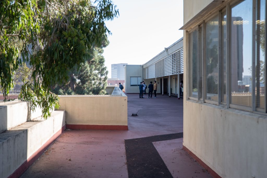 A group of doctorate students meet on the roof of Boelter Hall to discuss research. Although many rooms on the ninth floor host discussion sections for a spectrum of subjects, others serve as offices for UCLA's statistics department. Photographed by Julia Gu/BruinLife.