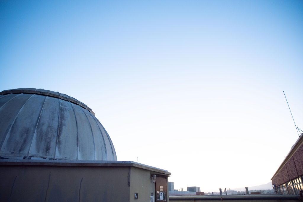The planetarium wakes up from its afternoon nap at dusk. The elevator at the main entrance of the Mathematical Sciences Building will bring students to the eighth floor, from where they can follow the planetarium signs to step out into the open air and greet MS 8224. Photographed by Julia Gu/BruinLife.