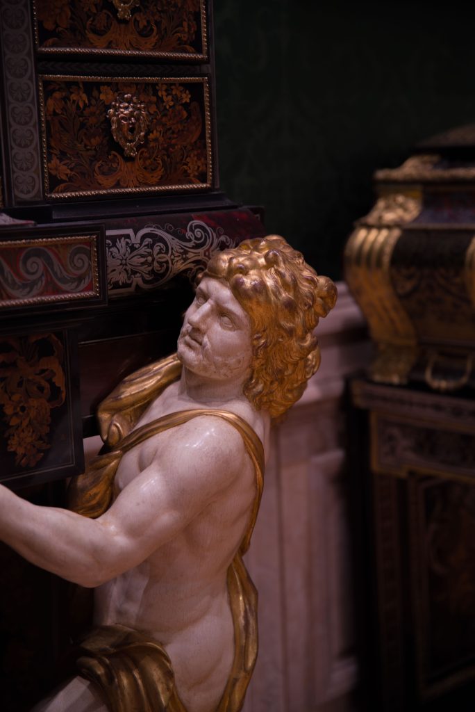 A white and gold marble statue forms the centerpiece of this room of furniture. The exhibitions of the Getty Museum typically have a central theme with highlights provided by other objects. Photo by Katelyn Michel/BruinLife.