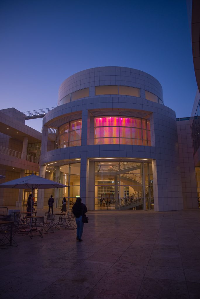 As the evening sets in, the iridescent colored film in the Getty Museum entrance peeks through in bursts of color. Photo by Katelyn Michel/BruinLife.