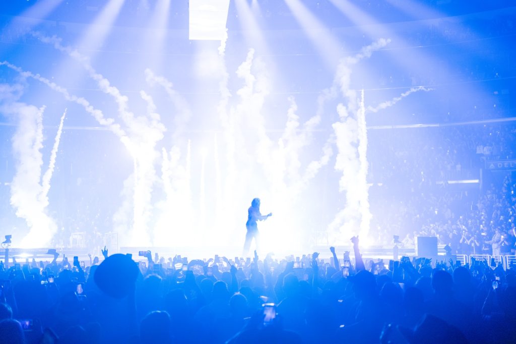 Bad Bunny, commonly known by his first name Benito, performs his hit song "MONACO" surrounded by impressive pyrotechnics and lighting projections. The crowd&squot;s energy was palpable as they jumped and cheered along while Bad Bunny made the stage his own.