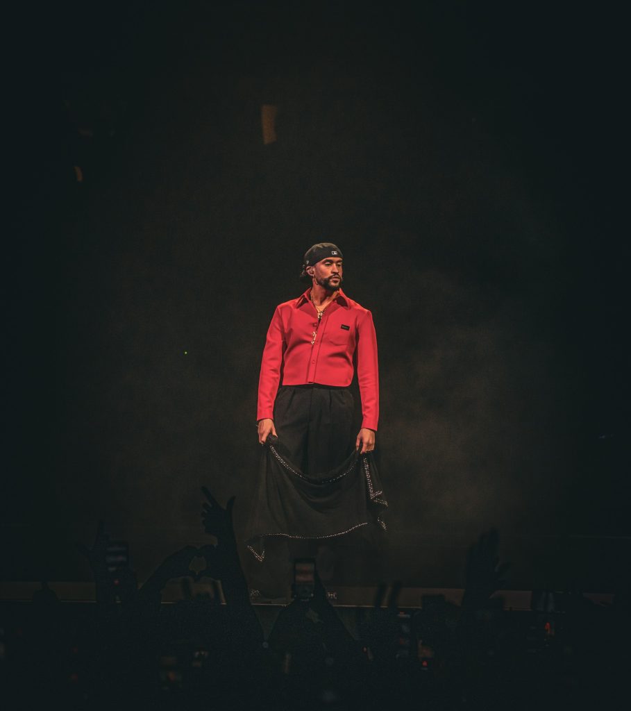 Performing his third song of the night "FINA," Bad Bunny looks out at the crowd as they chant each word back to him.