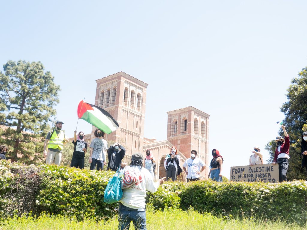 A single protester is turned away from the Janss/Kuruvungna-Steps-facing side of the pro-Palestine encampment. Photographed by Finn Martin/BruinLife.