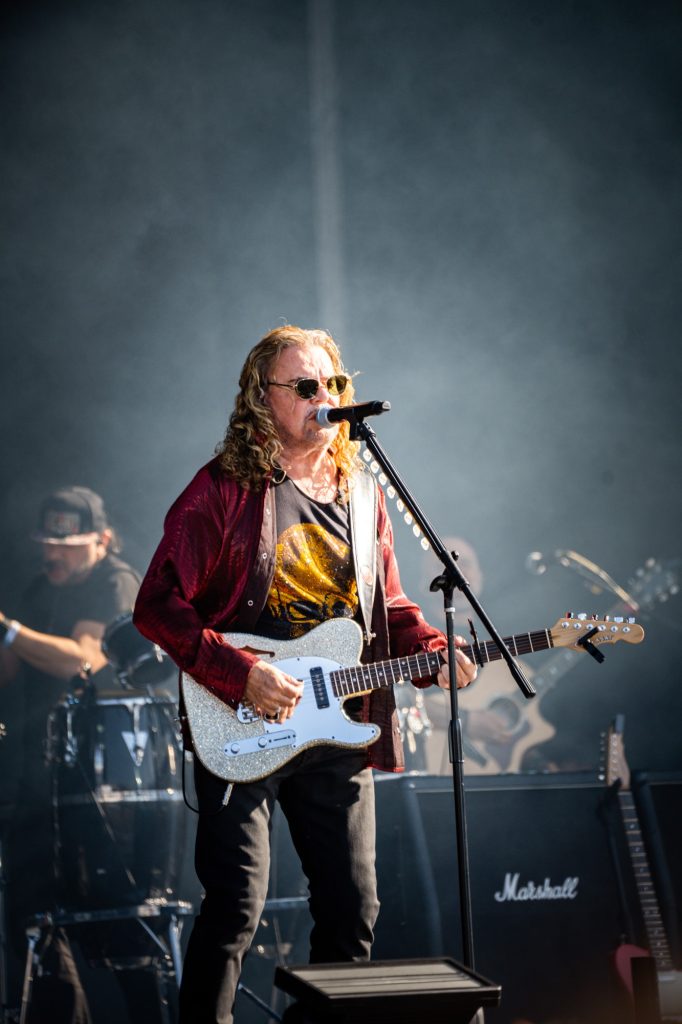 Fher Olvera demonstrates his perfect guitar skills while fronting the band's vocals as they perform on the JaM Cellars Stage. Photographed by Cathryn Kuczynski/BruinLife