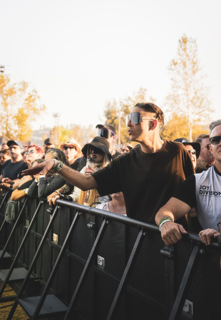 The crowd at the set of Simple Minds as they dance along to the band's numerous hits. Photographed by Cathryn Kuczynski/BruinLife