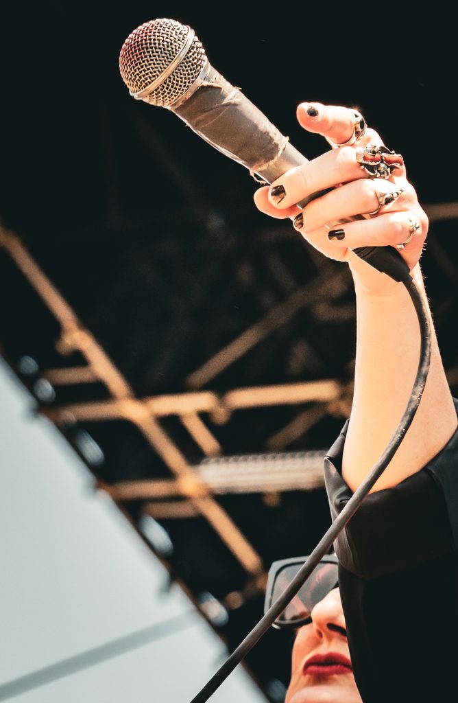 ADULT. gets the crowd excited for a full day of music at the Outsiders stage on Saturday afternoon. Photographed by Cathryn Kuczynski/BruinLife