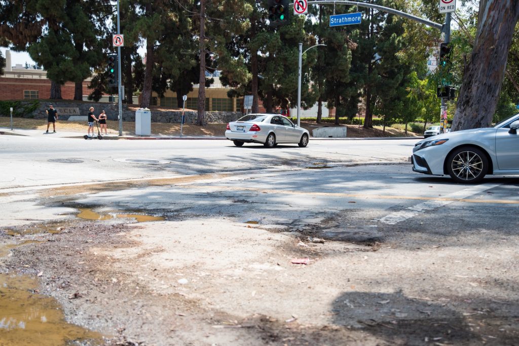 Potholes located near the intersection of Gayley Avenue and Strathmore Drive. Photographed by Caleb Velasquez/BruinLife.