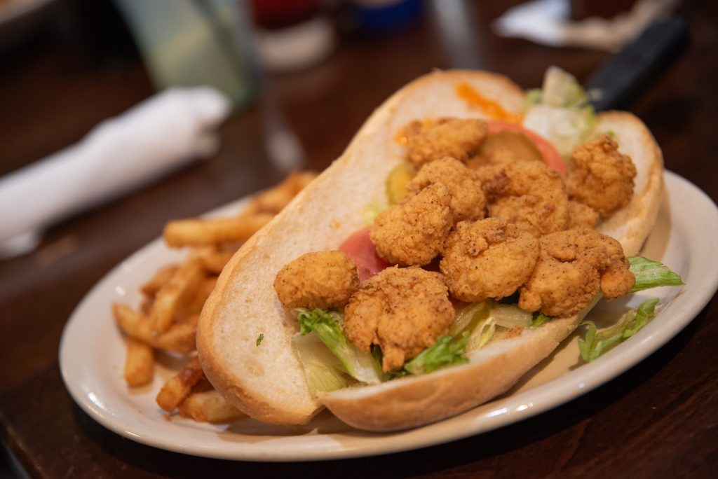 Crunchy and few, the fried shrimp offered in the Creole House's Po-Boys underwhelms but does not disparage this classic sandwich. Photographed by Finn Martin/BruinLife.