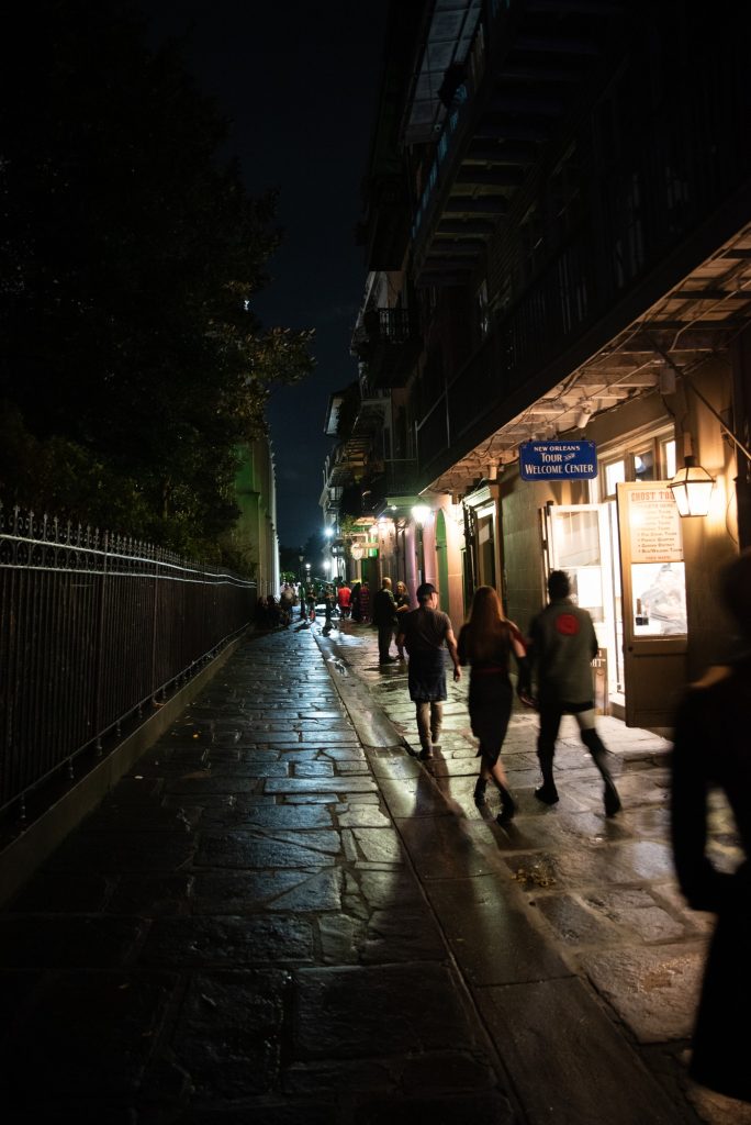 Following the footsteps of the Creole Revolutionaries of 1768, the ghost tour proceeds down Pirate Alley. The French instigators of the Creole Revolution were chased down this alleyway by the forces of General Alejandro O'Reilly and caught and executed. Photographed by Finn Martin/BruinLife.