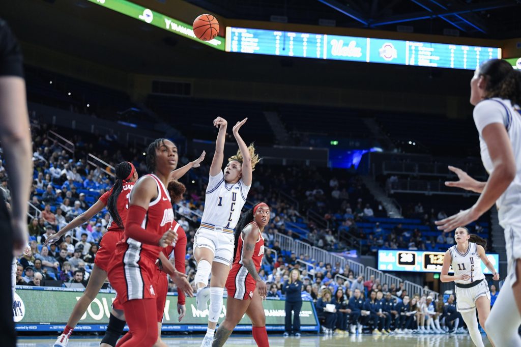 UCLA’s Kiki Rice pulls up in the paint over the Ohio State defense. Rice, a junior guard, wears number one for the Bruins. Photographed by Ryan Zhang/BruinLife