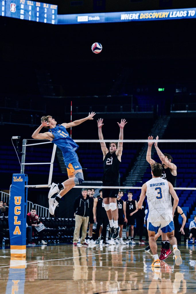 Outside hitter Cooper Robinson goes for the attack and earns a kill for the Bruins. Photographed by Cathryn Kuczynski/BruinLife.