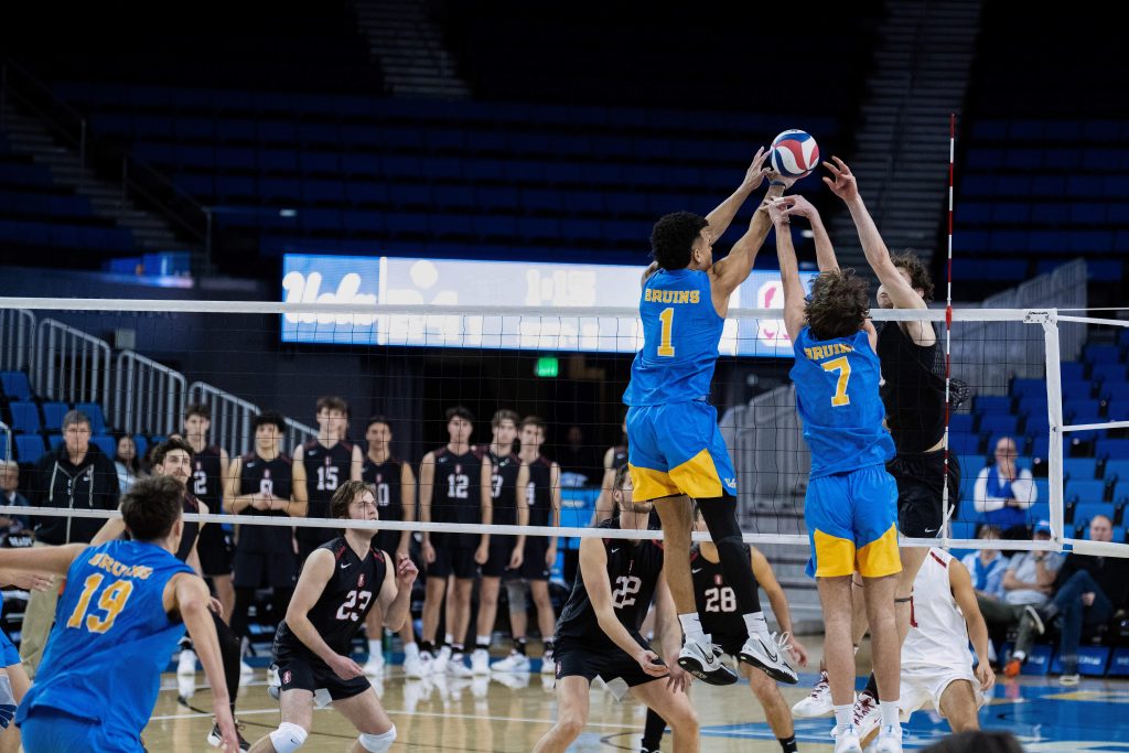 Cameron Thorne and Andrew Rowan go up for a block against Stanford's attack. Photographed by Amy Miranda/BruinLife