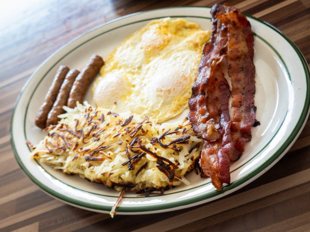 The Lumberjack Breakfast brings you breakfast served in triplets. The crisped bacon, eggs in any style, sausage links and potato hash are bound to give you enough fuel to lumber away at your day. Photographed by Finn Martin/BruinLife.