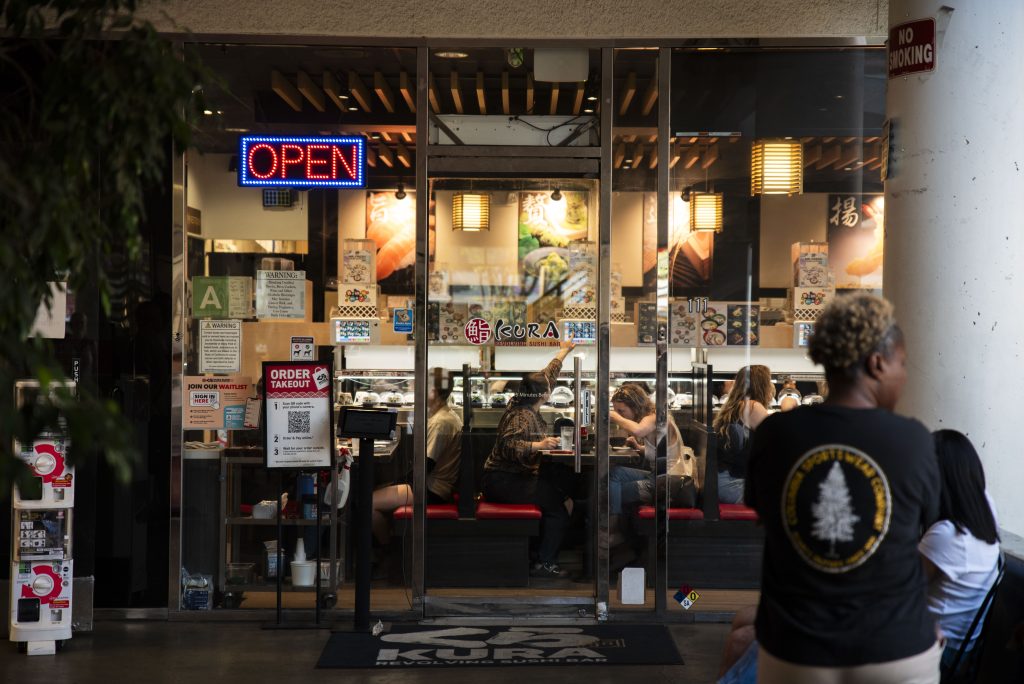 The front area of Kura, where customers wait their turn to be called in after placing their name on the waitlist. Photographed by Caleb Velasquez/BruinLife.