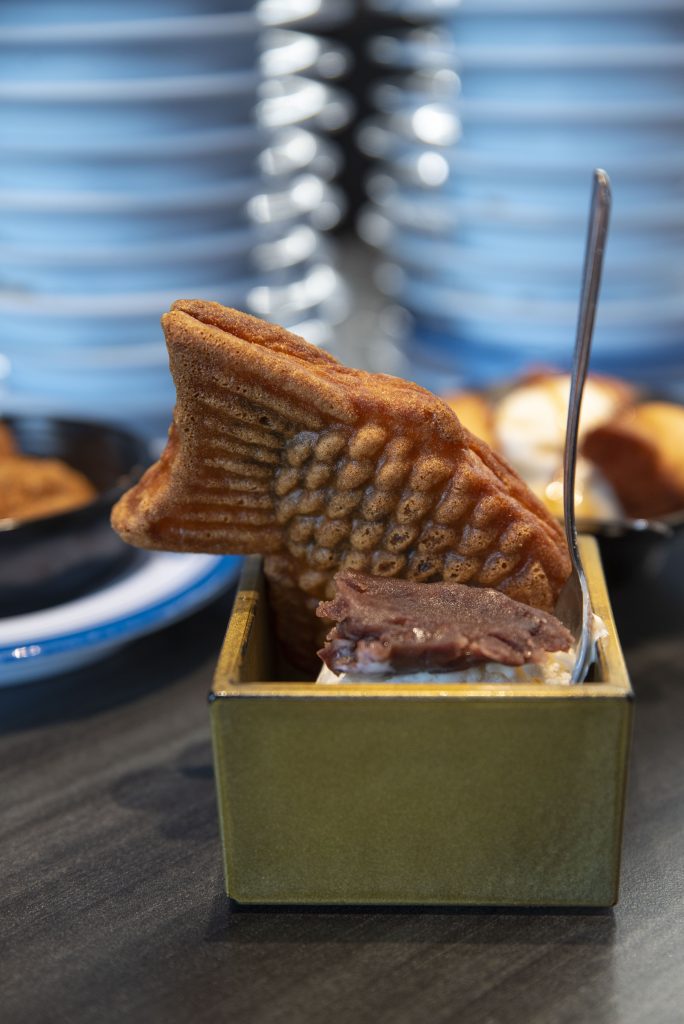 Taiyaki, a Japanese fish-shaped cake, served with ice cream and red bean paste on top. Photographed by Caleb Velasquez/BruinLife.