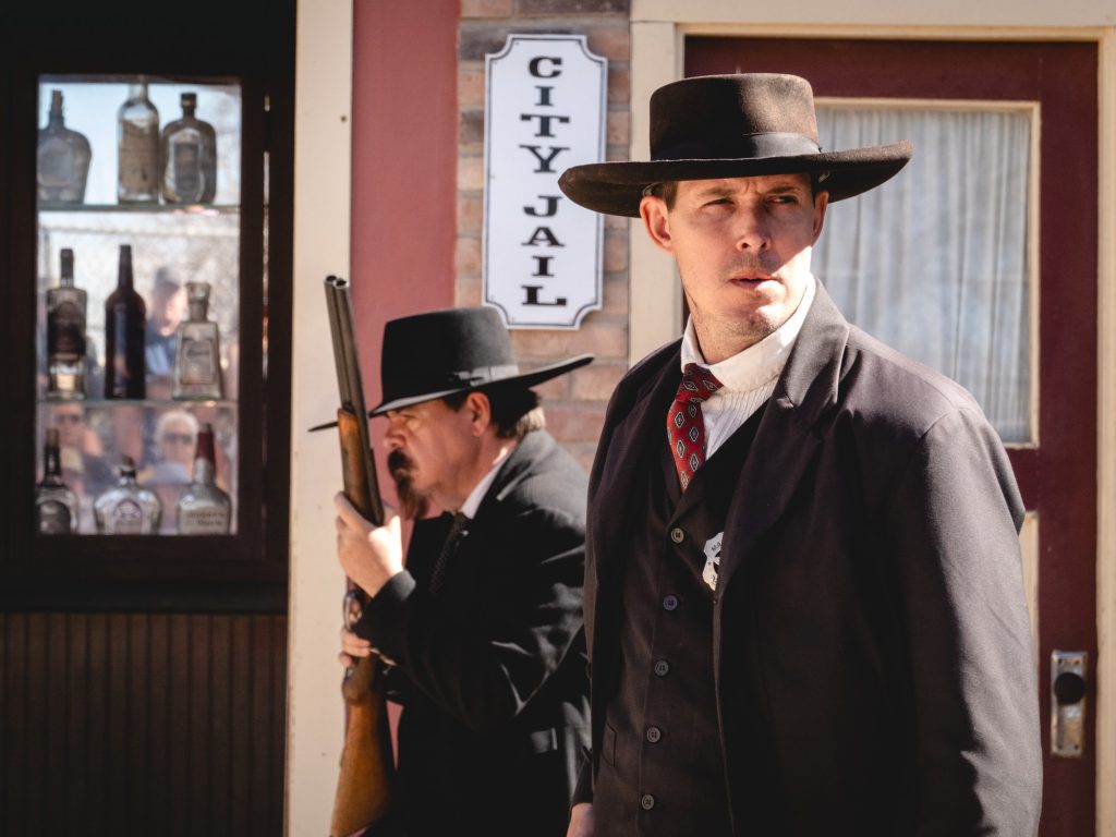Reenactors pose poised for the gunfight soon to come. In frontier towns flooded with mineral wealth, skirmishes between law and wild outlaws were only due course. Photographed by Finn Martin/BruinLife.