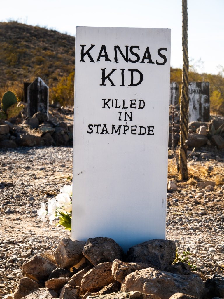 Here lies the Kansas Kid, a cowboy trampled by a stampede. Boot Hill Graveyard is site to simple graves and violent deaths. Photographed by Finn Martin/BruinLife.