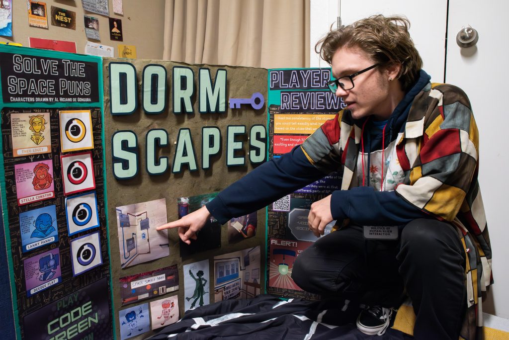 Fourth-year theater student Tyler Neufeld explains the rules of his escape room. Photographed by Khaled Al Duwaikat/BruinLife