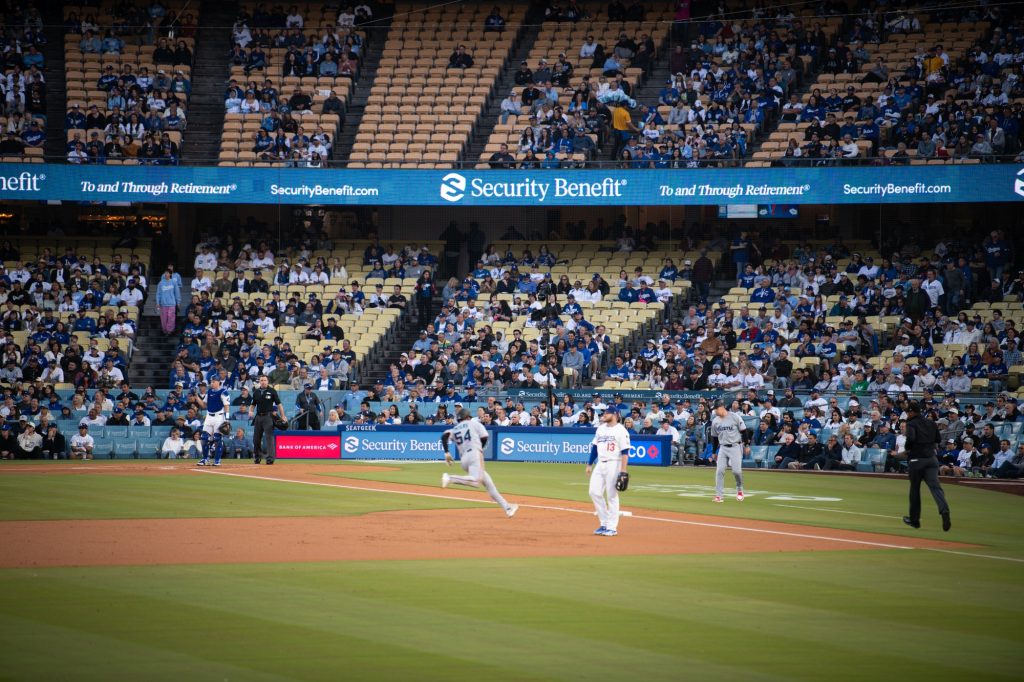 Dane Myers puts up a triple to start off the Marlins' offense. Photograph by Finn Martin/BruinLife.