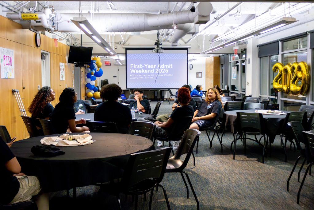 After an evening of setting up decor and dinner, members of the Pacific Islands' Student Association chat as they prepare to greet the first families of the night. The organization is 39 years old this year, and Admit Weekend has become a true tradition. Photographed by Julia Gu/BruinLife.