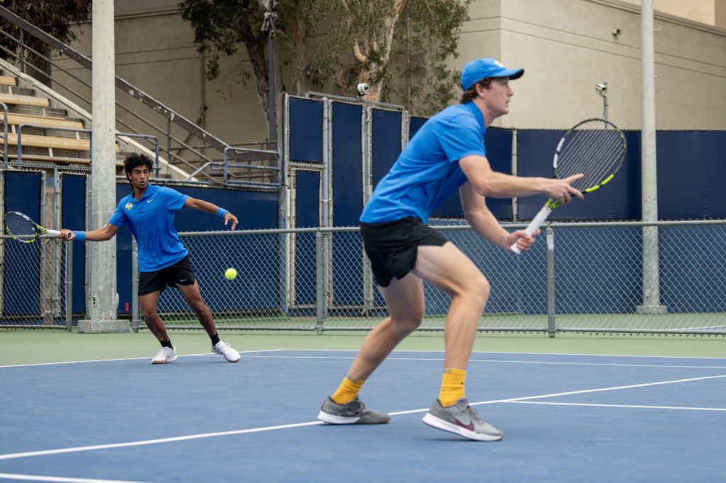 Aadarsh Tripathi and doubles partner Spencer Johnson begin their match strong with hitting 30-Love in the first match point. Photographed by Mira Daya/BruinLife