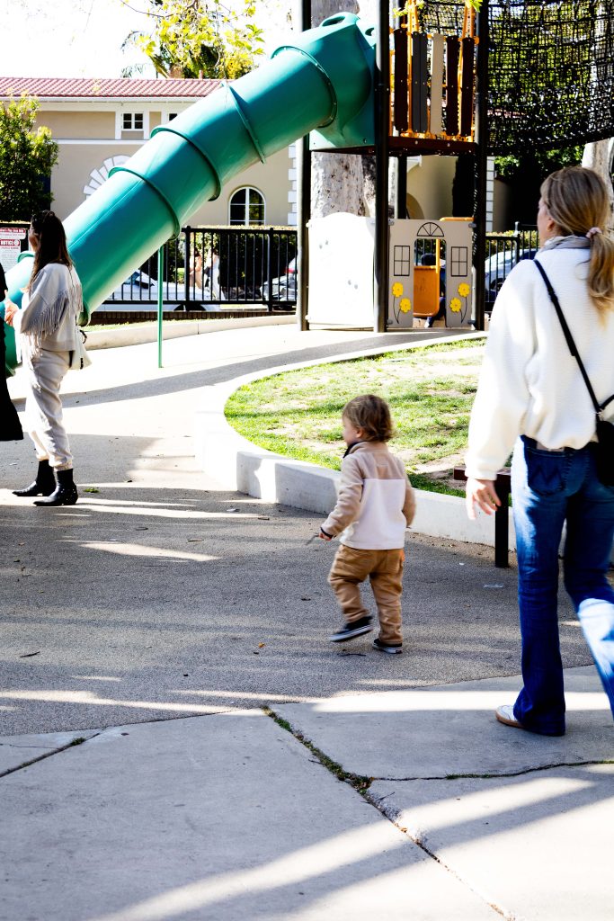 A toddler observes the play structure in front of him. Photographed by Julia Gu/BruinLife.