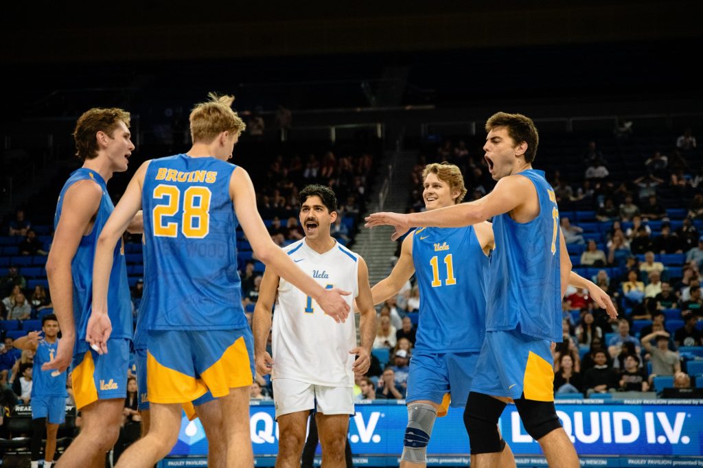 UCLA celebrates as it clinches the third set, taking a 2–1 lead. Photographed by Ryan Zhang/BruinLife.
