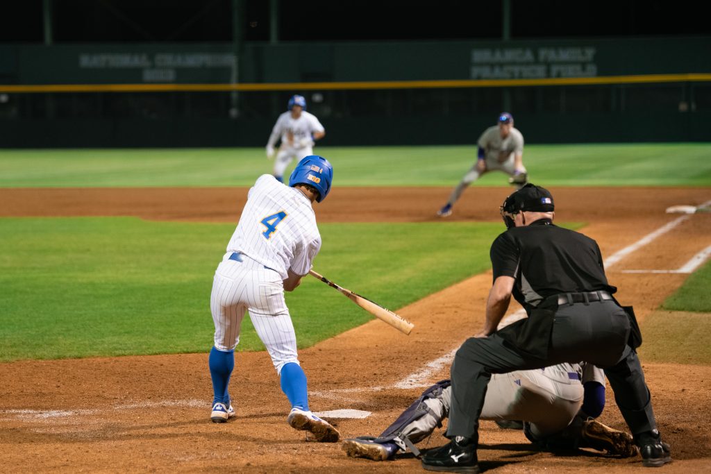 UCLA's infielder Phoenix Call swings while at bat.