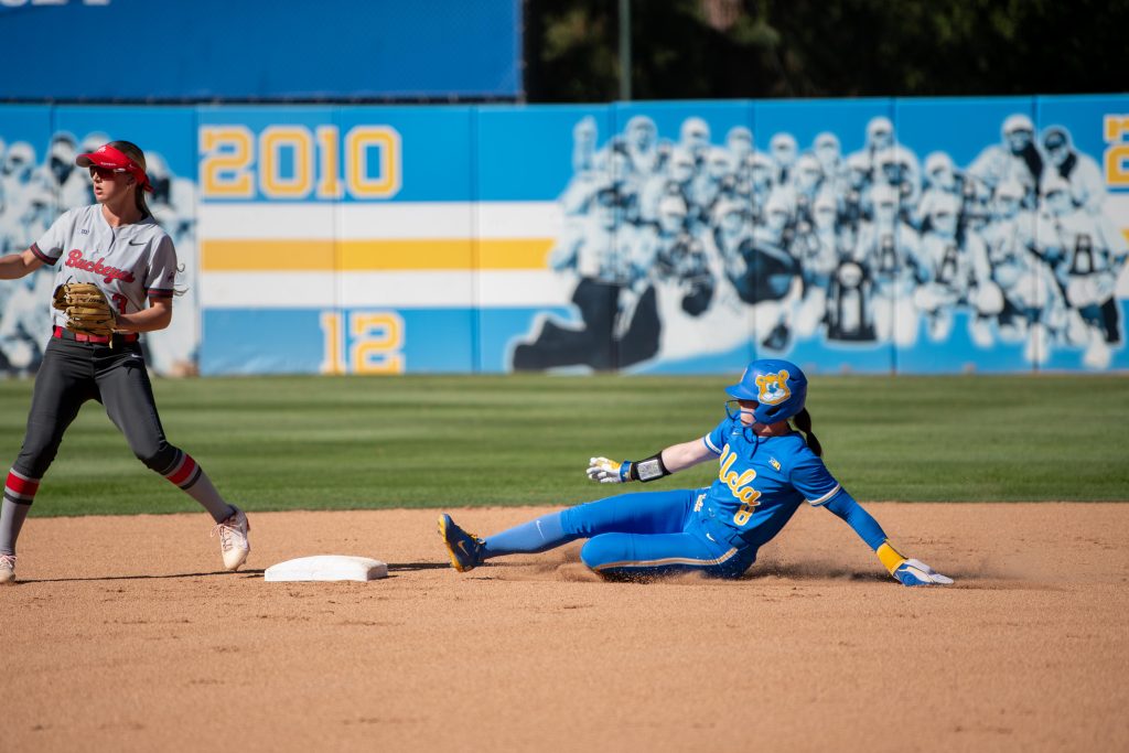 Outfielder Jessica Clements slides safely into second base in the third inning. Photographed by Maia Salti/ BruinLife