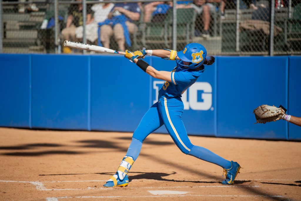 Outfielder Rylee Slimp follows through on her swing at the plate at Easton Stadium. Photographed by Maia Salti/BruinLife.
