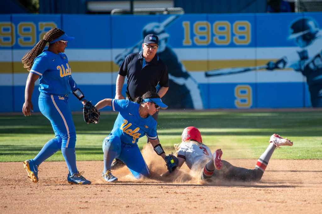 Utility player Savannah Pola places the tag on an Ohio State runner attempting to steal second base. Photographed by Maia Salti/Bruin Life