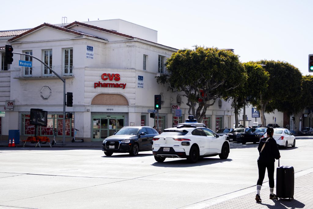 A Waymo autonomous vehicle drives through the Westwood-Weyburn intersection in Westwood Village. Introduced to the Los Angeles public in November 2024, the self-driving cars have become an item on many students' to-try lists. Photographed by Julia Gu/BruinLife.