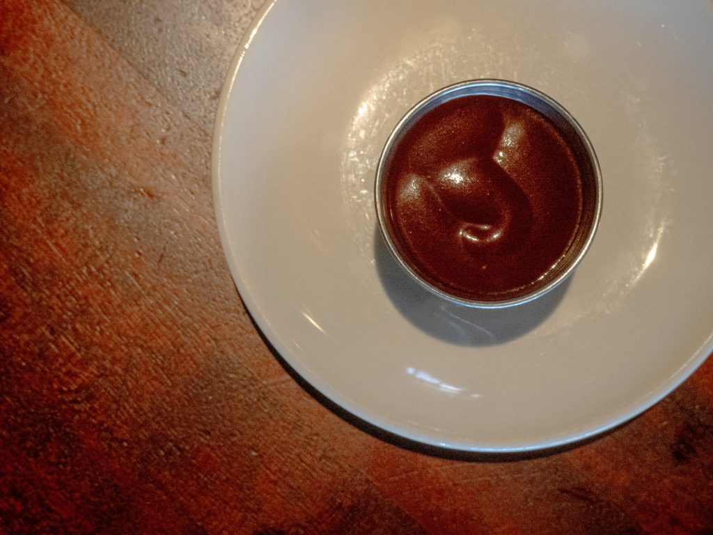 A sauce so good, the restaurant had to stop setting tables with it because patrons would drink from the bottles. Smokey, tomato-based and sweet, the Wood Ranch BBQ sauce works universally well with their menu. Photo by Finn Martin/BruinLife.
