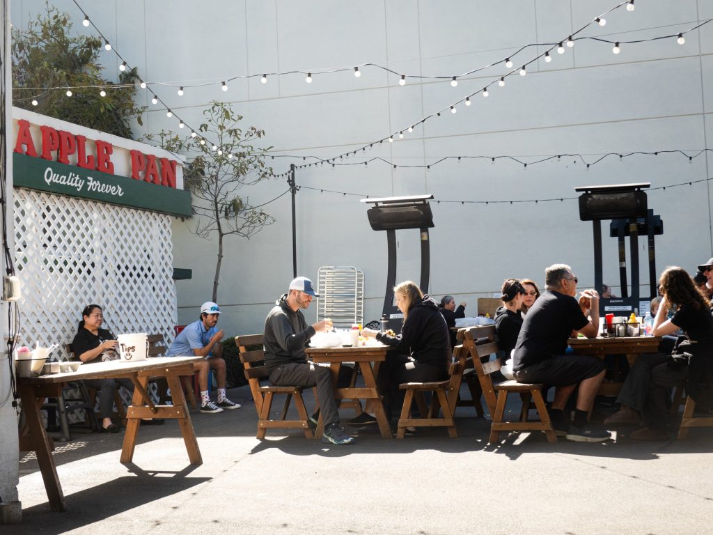 The backside outdoor patio offers a picnic table overflow for those who couldn't find a spot inside or those who choose to enjoy their burgers with some sunshine. Photographed by Finn Martin/BruinLife.