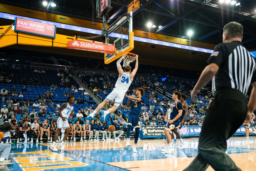 #35 Tyler Bilodeau throws down a thunderous alley-oop dunk off a perfect feed from #2 Donovan Dent as the Bruins dominate UCI at Pauley Pavilion. Photographed by Ryan Zhang/BruinLife.