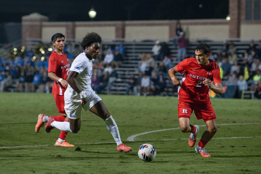 Defender Shakir Nixon is seen trying to keep the ball away from Rutger's defenders.