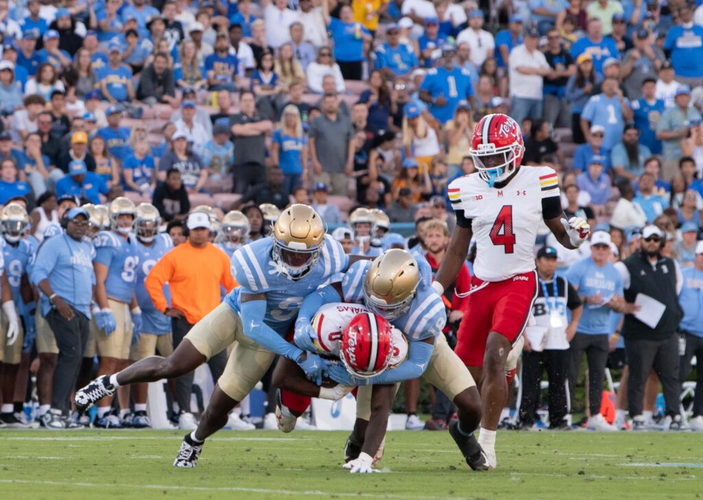 A pair of UCLA defenders tackle a Terrapin. Photographed by Aamani Maddukuri/BruinLife.
