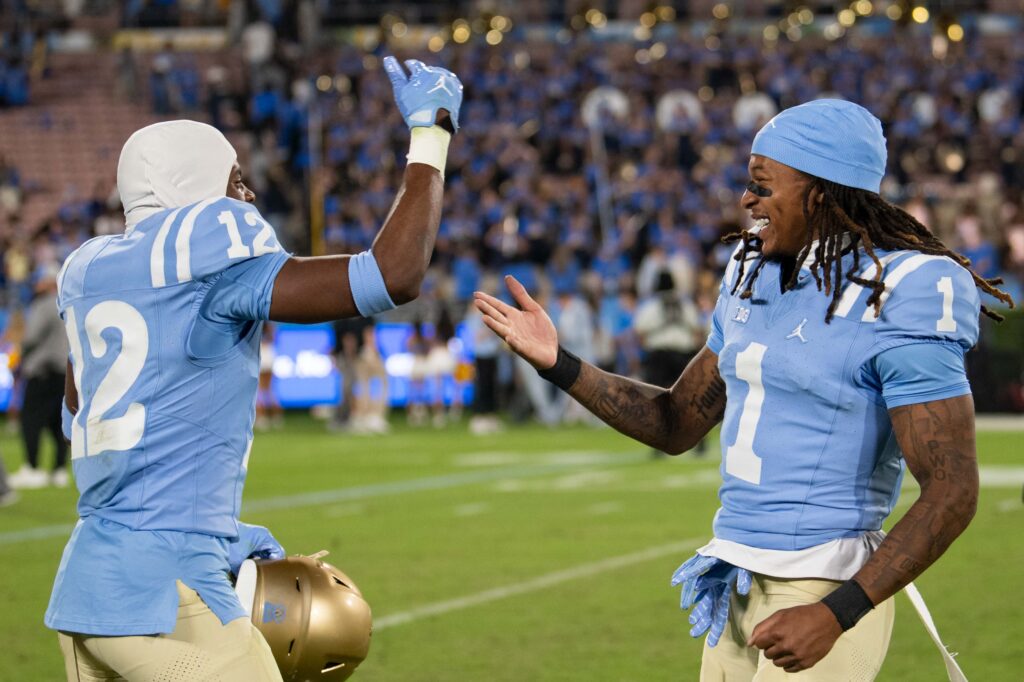 Rico Flores Jr. and Jamir Benjamin celebrate their victory. Photographed by Aamani Maddukuri/BruinLife.