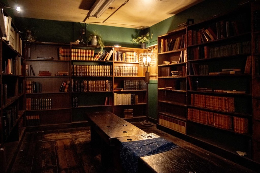 The Antique Books room, past the young adult section of the store, houses tax records and other large books from the 1970s and beyond. Even the lights come from an age different from ours. Photographed by Julia Gu/BruinLife.