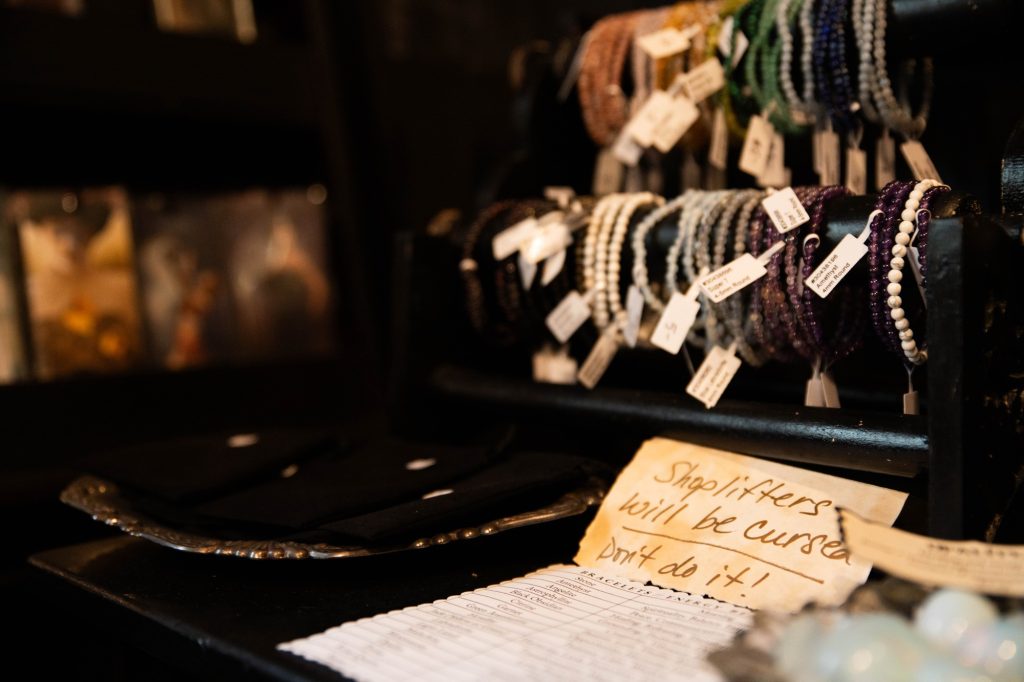 A sign playfully warns customers of the dangers of thievery. Many of the shops on the second floor have been run by their current owners since the opening of The Last Bookstore. Photographed by Julia Gu/BruinLife.