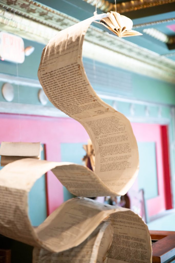 A scroll of book pages is suspended from the ceiling as if by magic. The Last Bookstore is known for its book sculptures, and the second floor does not disappoint, greeting visitors with many such installations. Photographed by Julia Gu/BruinLife.