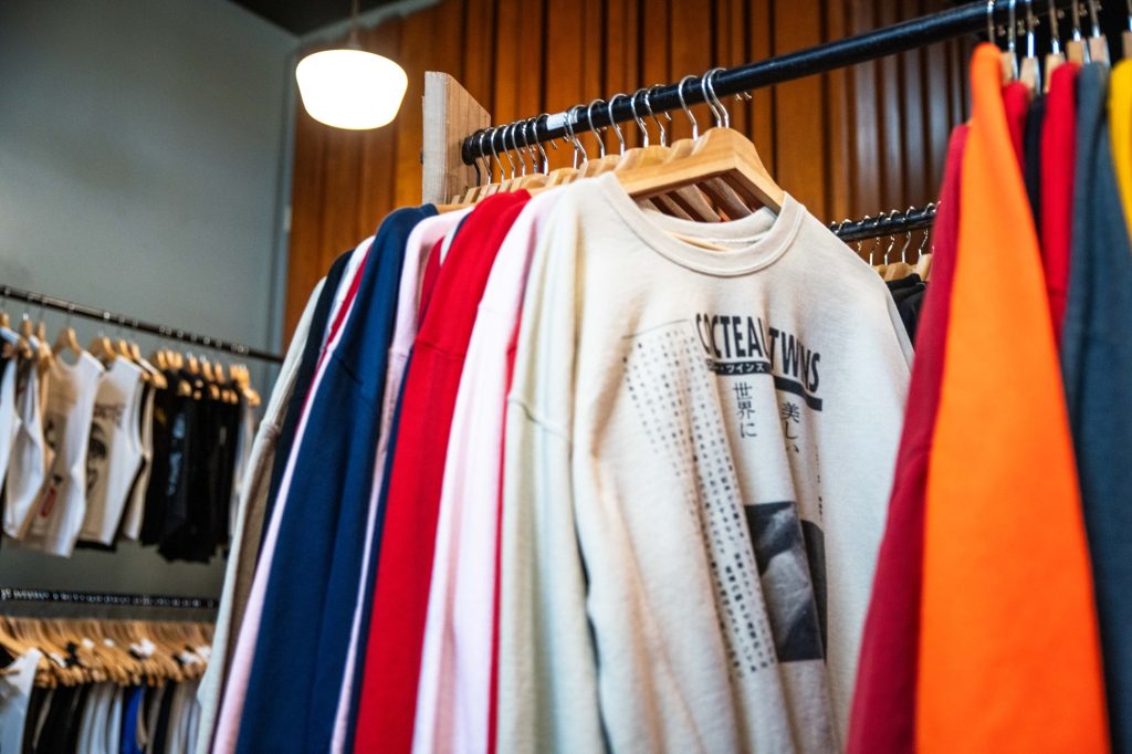 The Last Bookstore's clothing section has everything from graphic sweatshirts to graphic crop tops to graphic T-shirts. Sunglasses sit in their own glass display to complete the look. Photographed by Julia Gu/BruinLife.