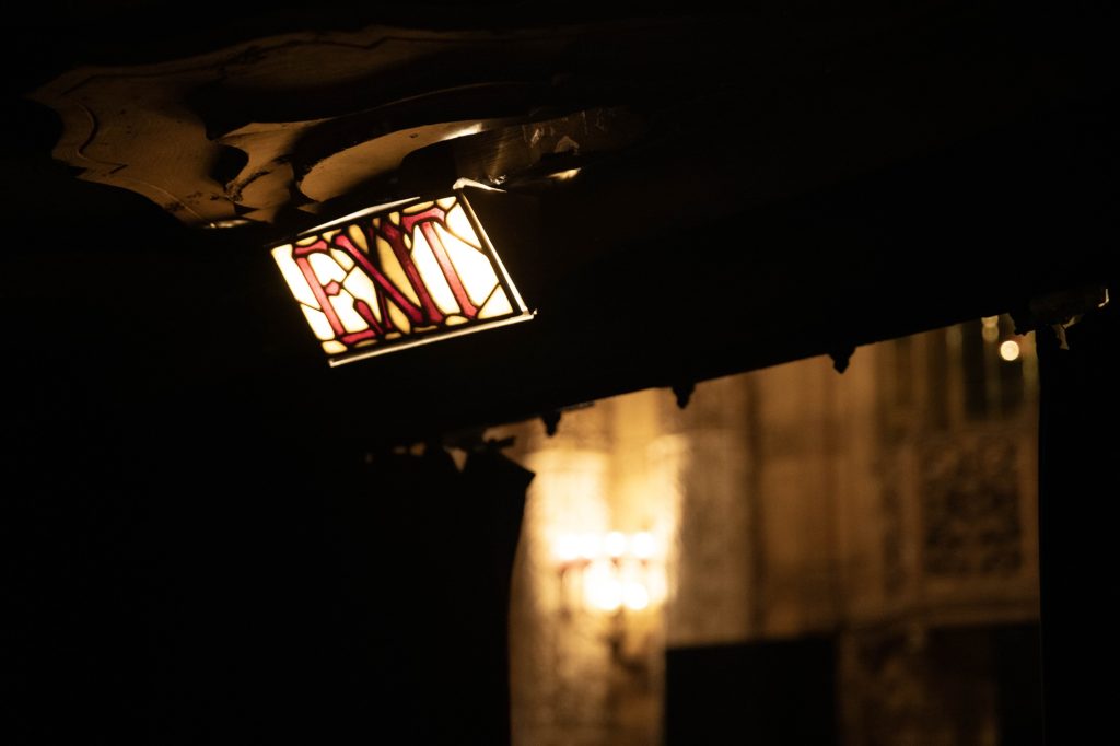 The stained glass "EXIT" sign in the United Artists Theatre shows the amount of attention and care put into the construction of this theater. Photographed by Julia Gu/BruinLife.