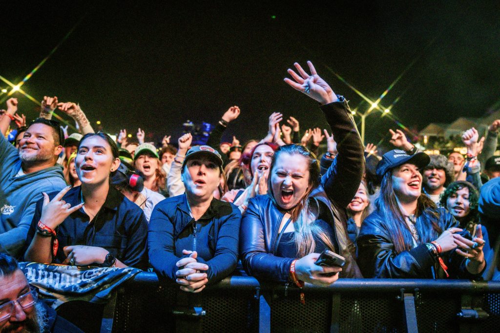 Fans cheer in excitement in the moments leading up to Sublime taking the stage. Photographed by Cathryn Kuczynski/BruinLife.