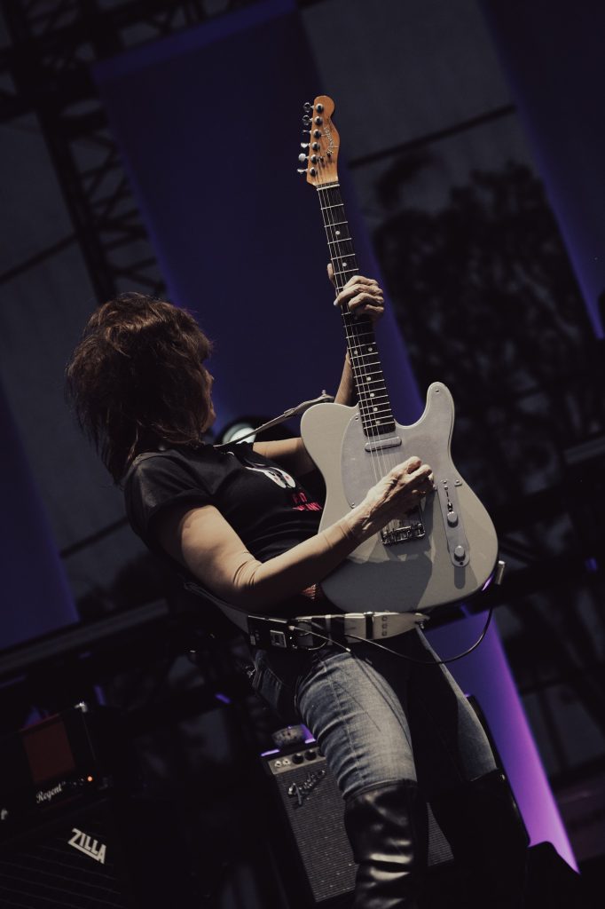 Chrissie Hynde, lead vocalist of renowned British rock band The Pretenders, shreds on her guitar while performing at Beachlife Festival on Saturday evening. Photographed by Cathryn Kuczynski/BruinLife.
