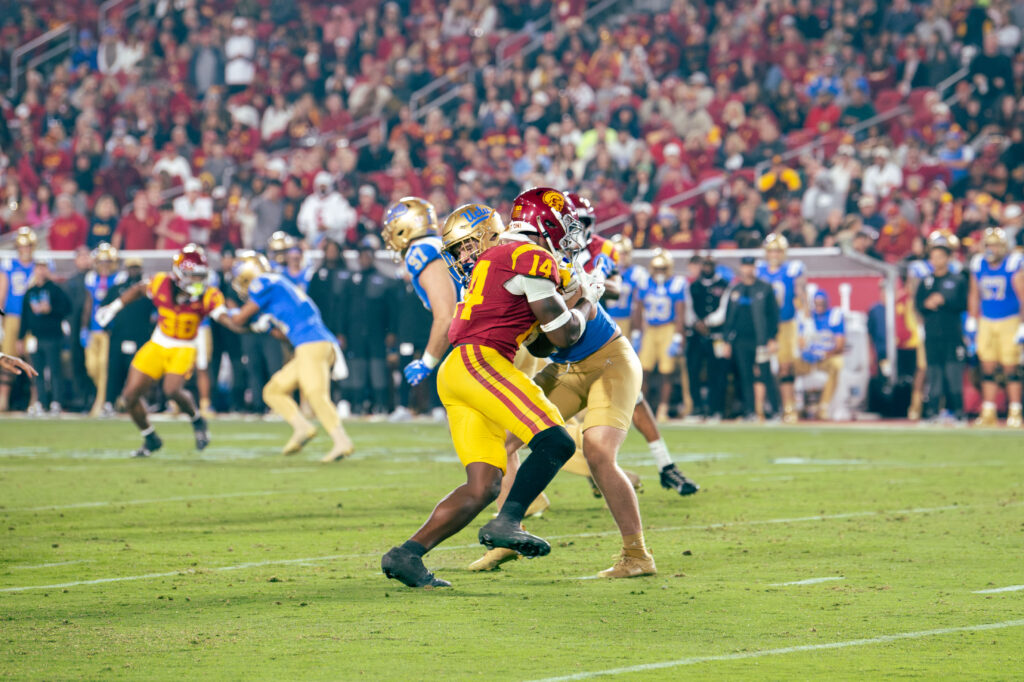 USC's Ta'Mere Robinson fights back against UCLA's offense. Photographed by Catherine Rodriguez/BruinLife.