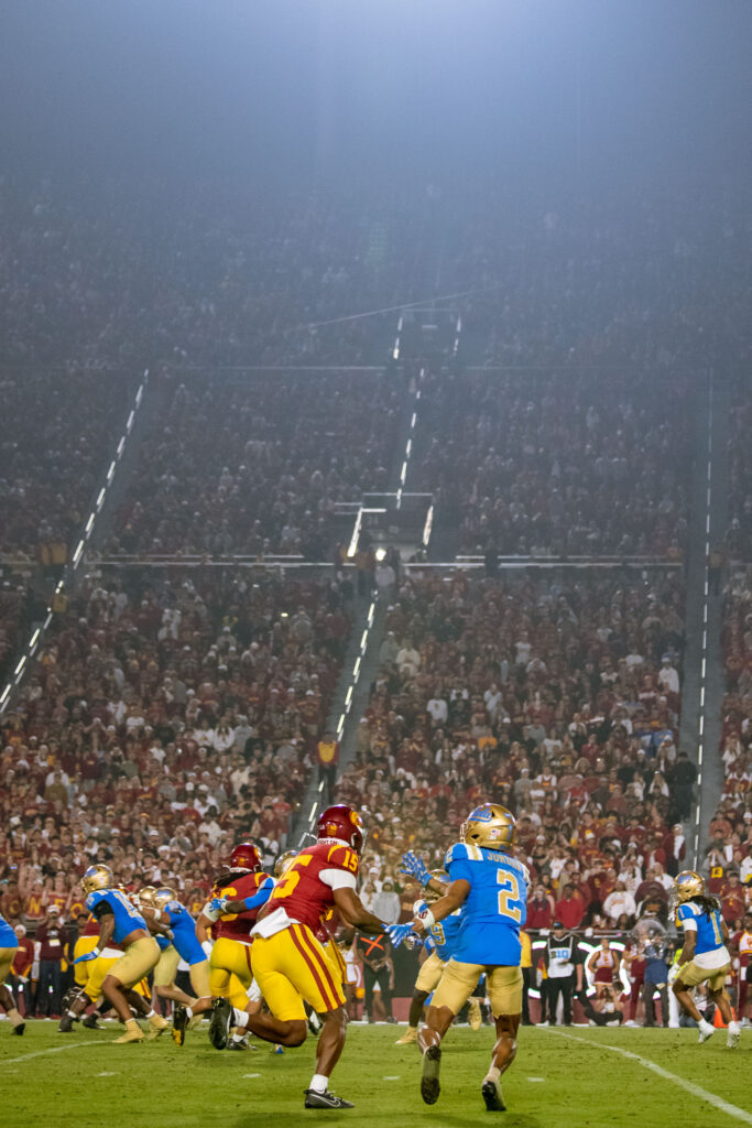 UCLA's wide receiver Titus Mokia-Atimalala shakes his defender and gets open for a reception. Photographed by Catherine Rodriguez/BruinLife.